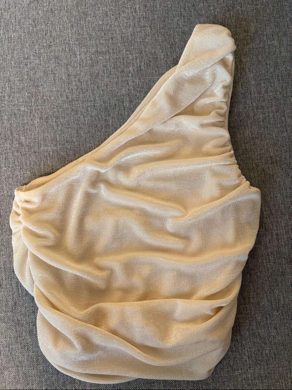 Shimmery One-Shoulder Cream Top with Draped Silhouette